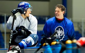 Jaromir Jagr, right, talks to teammates during a practice session with the Kladno Knights in Kladno, Czech Republic. Just three days after the right-w