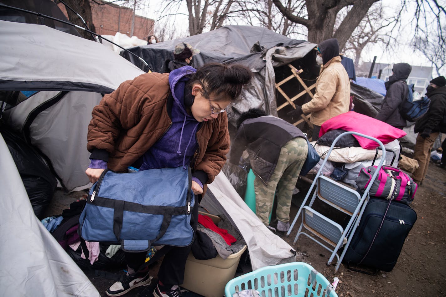 Resident Ivy Elliott packs up to leave ahead of the shutdown of Camp Nenookaasi in Minneapolis, Minn., on Thursday, Jan. 4, 2024. The City of Minneapolis is planning to clear out the large homeless encampment over public safety and health concerns. ] RICHARD TSONG-TAATARII • richard.tsong-taatarii @startribune.com