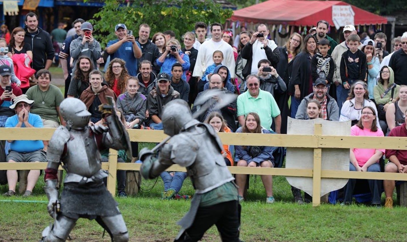 A large crowd watched two knights battle at the end of the jousting competition.