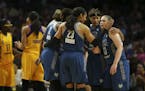 The Lynx players on the floor gathered for a huddle after Lynx forward Maya Moore (23) was fouled late in the fourth quarter. At right are Minnesota L