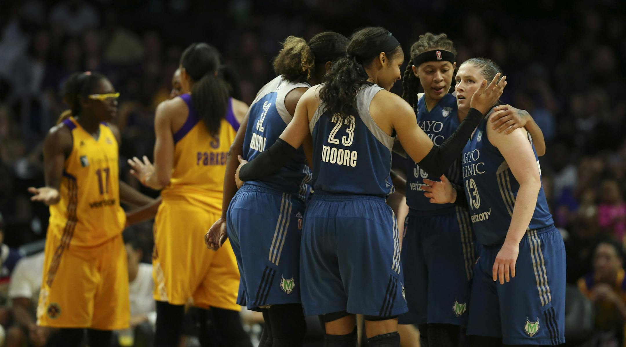The Lynx players on the floor gathered for a huddle after Lynx forward Maya Moore (23) was fouled late in the fourth quarter. At right are Minnesota Lynx guards Seimone Augustus (33) and Lindsay Whalen (13). ] JEFF WHEELER ï jeff.wheeler@startribune.com The Minnesota Lynx outlasted the Los Angeles Sparks 85-79 in a crucial Game 4 of their WNBA Finals series Sunday evening, October 16, 2016 at Staples Center in Los Angeles.