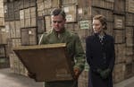 In a train warehouse in Paris, GRANGER (Matt Damon) picks up a painting with CLAIRE (Kate Blanchett) in Columbia Pictures' THE MONUMENTS MEN. ORG XMIT