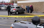 Police investigate the scene of an attempted car jacking following a fatal shooting Friday, Nov. 12, 2021 outside the Cub Foods in north Minneapolis. 