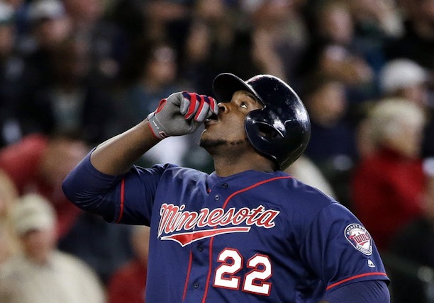 Minnesota Twins' Miguel Sano gestures before pointing skyward as he crosses home on his home run against the Seattle Mariners in the fourth inning of a baseball game Sunday, May 29, 2016, in Seattle. The Twins won, 5-4.