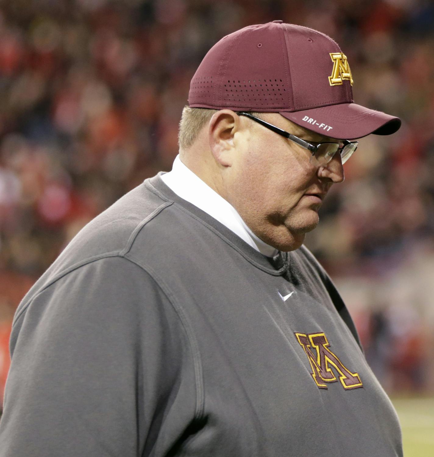 Minnesota head coach Tracy Claeys walks off the field following an NCAA college football game against Nebraska in Lincoln, Neb., Saturday, Nov. 12, 2016. Nebraska won 24-17. (AP Photo/Nati Harnik) ORG XMIT: MIN2016112721022231