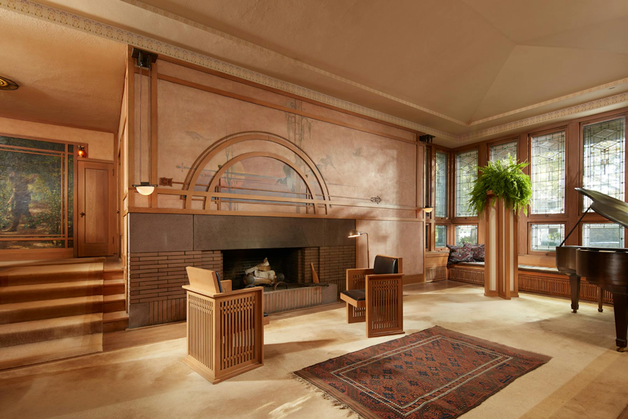 Purcell-Cutts House, 2328 Lake Place, Minneapolis, Minnesota, 1913, William Gray Purcell, Architect.George Elmslie, George Feick Jr. partners in firm Purcell, Feick and Elmslie, Edna S. Purcell House, Prarie School Style, Open floor plan, Art Glass windows, Writing Nook, Fireplace wall Mural by Charles Livingston Bull, Louisana Herons Flying with two Moons, Iridescent glass mortered in frieplace base, Stencil pattern, Peak a Book stained glass entry, Grandfather Gray portrait by Lawton Parker in Entrance Hall, Dining room Art Glass double door to screend-in Porch, Reflecting Pool and landscape designed by Harry Franklin Baker, Living room, Stair Hall, Master Suite, Sleeping Porch, Built in cedar floor storage, fireplace, childrens room connected to master with accordian style operating partition, sunken Living room,tent Ceilings, Ceiling Lights and art glass by Mosaic Art Shops Minneapolis, Maid Call Button, Air conditioning, Central vacuum system, sliding kitchen door operated by foot button, icebox in kitchen with door to outside, custom Sitting chair, Custom Floor lamp, Custom Dining room table,chairs and sideboard, Custom Cluster Pendant lighting, Oak hardwood floors and trim, Custom Throw rugs, Continuous tented roof and ceiling, Elevated dining room, dropped floor living room, "Little Joker", Personalized home with monogram ESP for Edna S. Purcell,