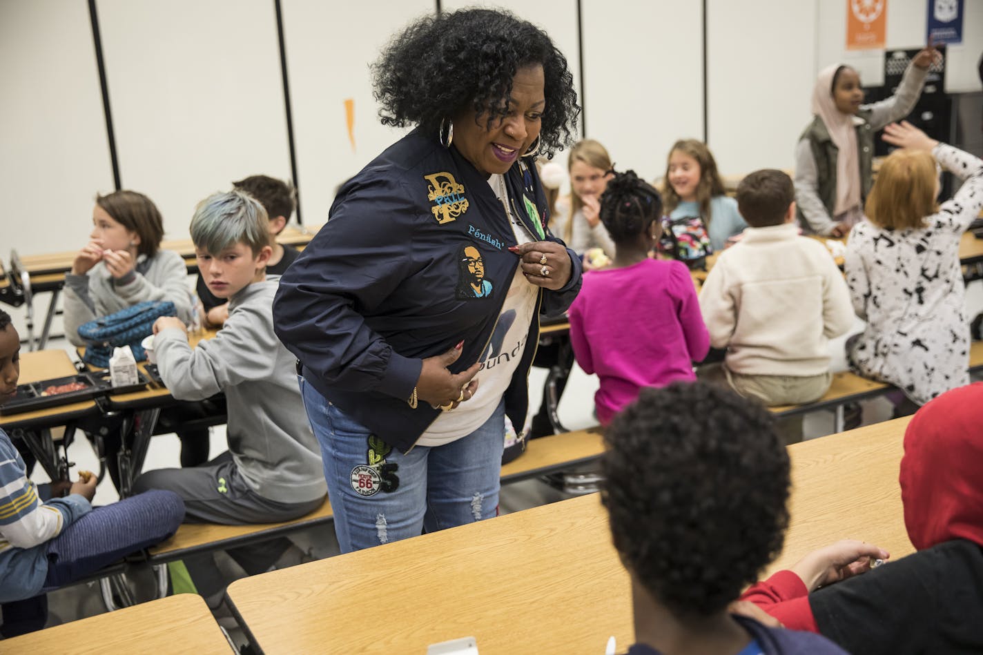 Valerie Castile, mother of Philando Castile, showed a group of children the custom jacket she had made in his honor as she arrived for an event to announce a donation of $10,000 from the "Philando Feeds the Children" effort at J.J. Hill Montessori in St. Paul, Minn., on Friday, October 13, 2017. ] RENEE JONES SCHNEIDER &#x2022; renee.jones@startribune.com can't use names