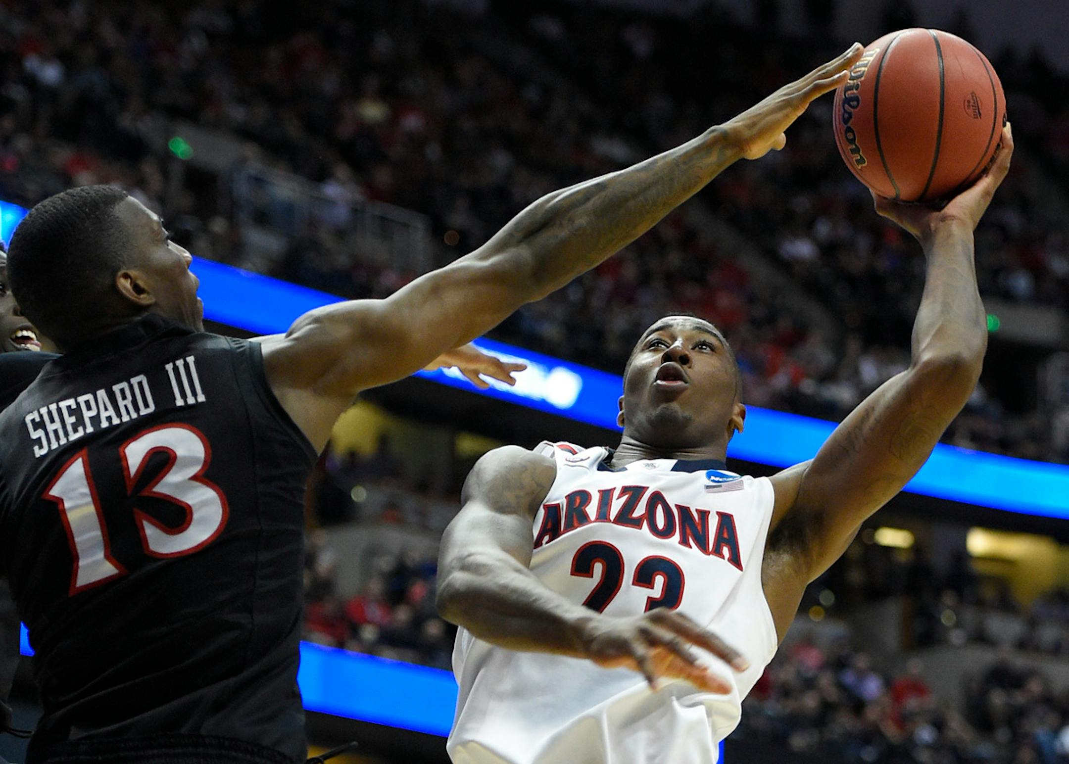 Arizona forward Rondae Hollis-Jefferson (23) shoots over San Diego State forward Winston Shepard (13) during the first half in a regional semifinal of the NCAA men's college basketball tournament, Thursday, March 27, 2014, in Anaheim, Calif. (AP Photo/Mark J. Terrill)