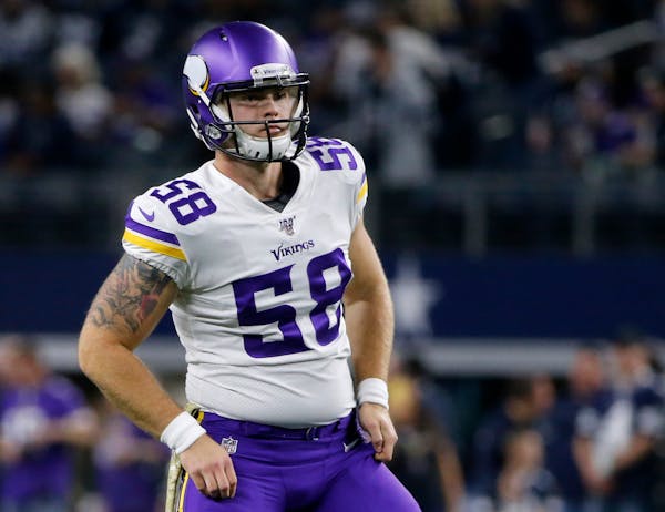 Minnesota Vikings long snapper Austin Cutting (58) warms up before an NFL football game against the Dallas Cowboys in Arlington, Texas, Sunday, Nov. 1