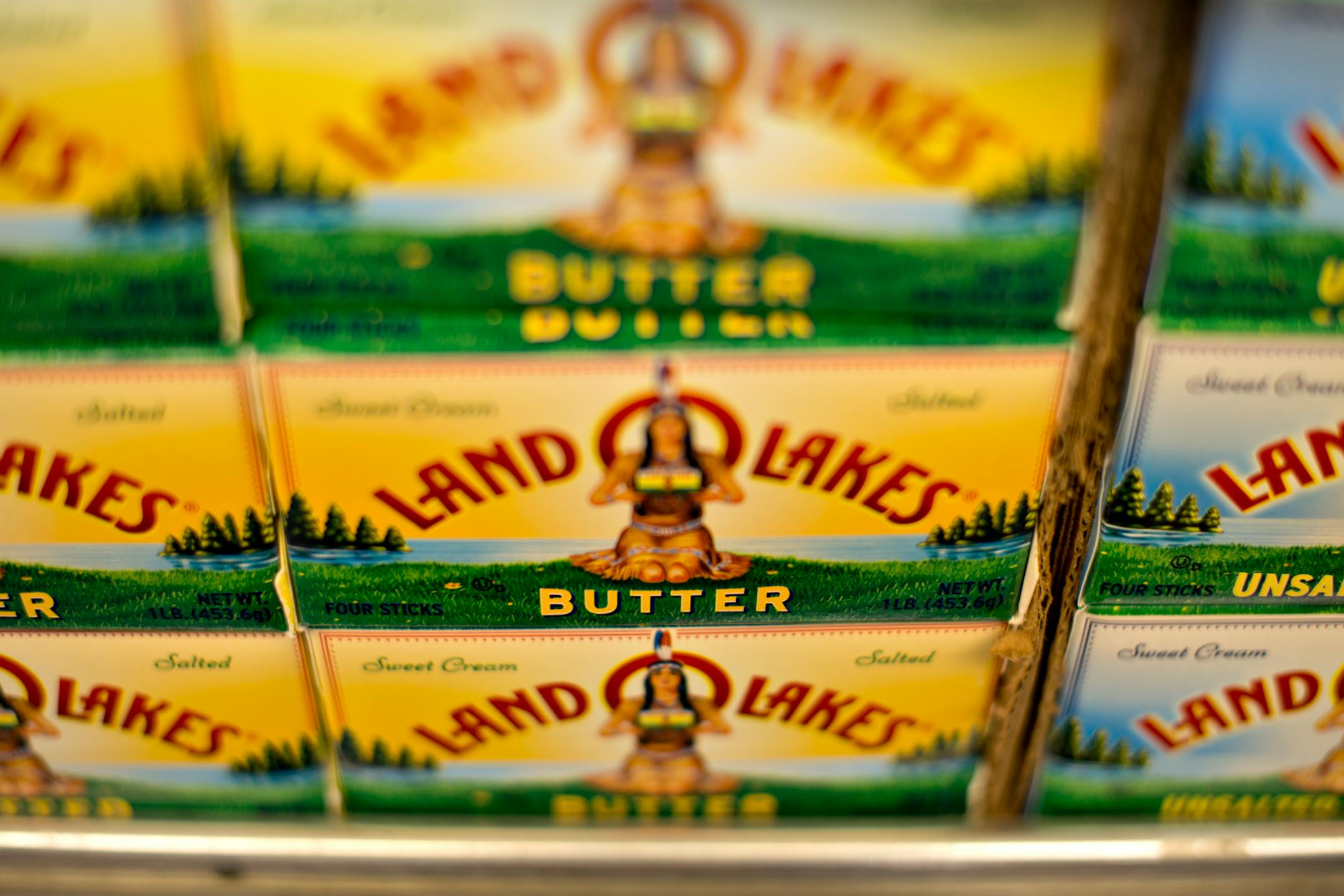 Land O' Lakes Inc. brand butter sits on display at a supermarket in Princeton, Illinois, U.S., on Tuesday, June 4, 2013. The Food and Agriculture Organization of the United Nations will release its monthly food price index on June 6. The index, a measure of the monthly change in international prices of a basket of food commodities, consists of the average of five commodity group price indices including meat, dairy, grains, oil and sugar. Photographer: Daniel Acker/Bloomberg