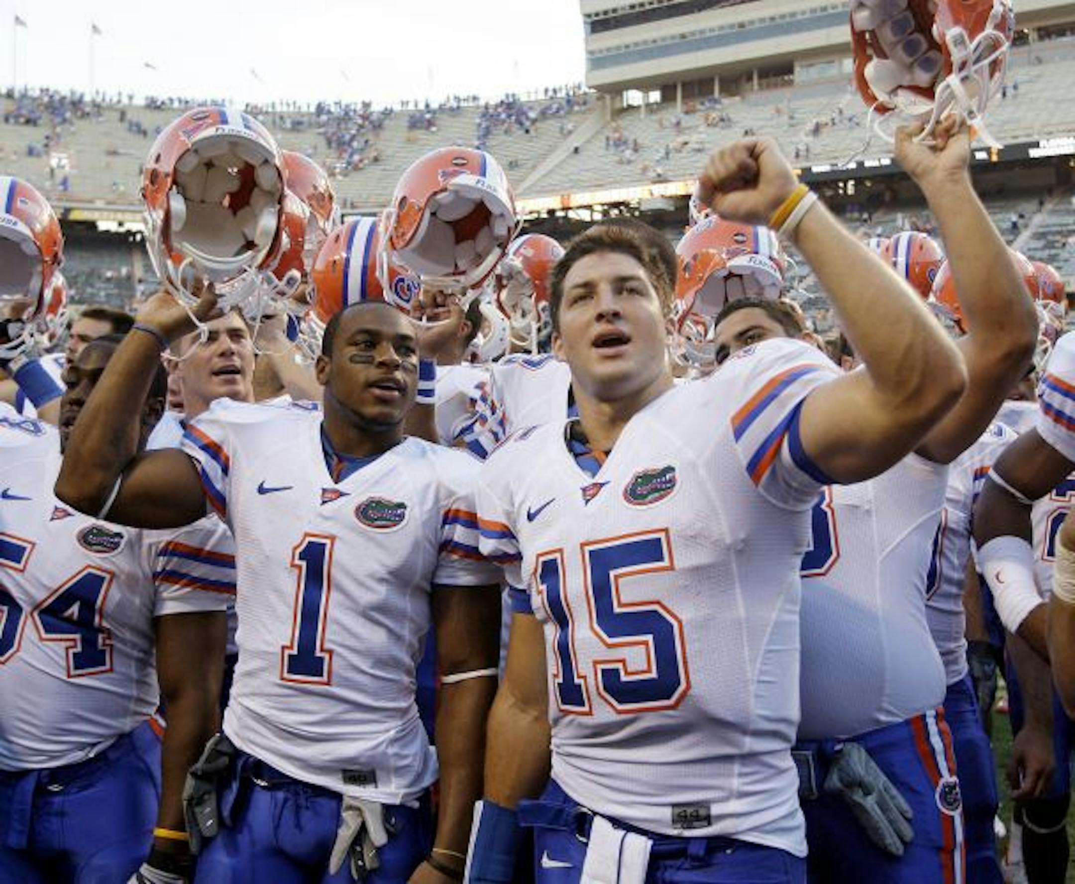 Florida quarterback Tim Tebow (15) and running back Percy Harvin (1) celebrate after beating Tennessee 30-6 in an NCAA college football game in Knoxville, Tenn., Saturday, Sept. 20, 2008.