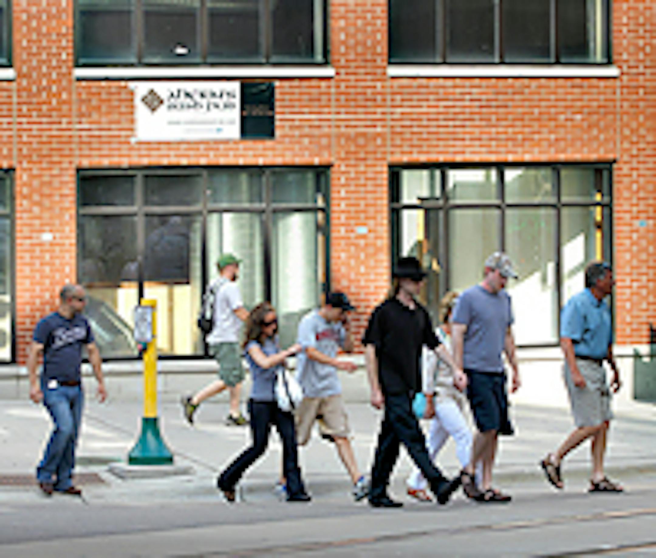 Twins fans walk past one of the biggest mysteries in downtown Minneapolis: Ahern's Irish Pub