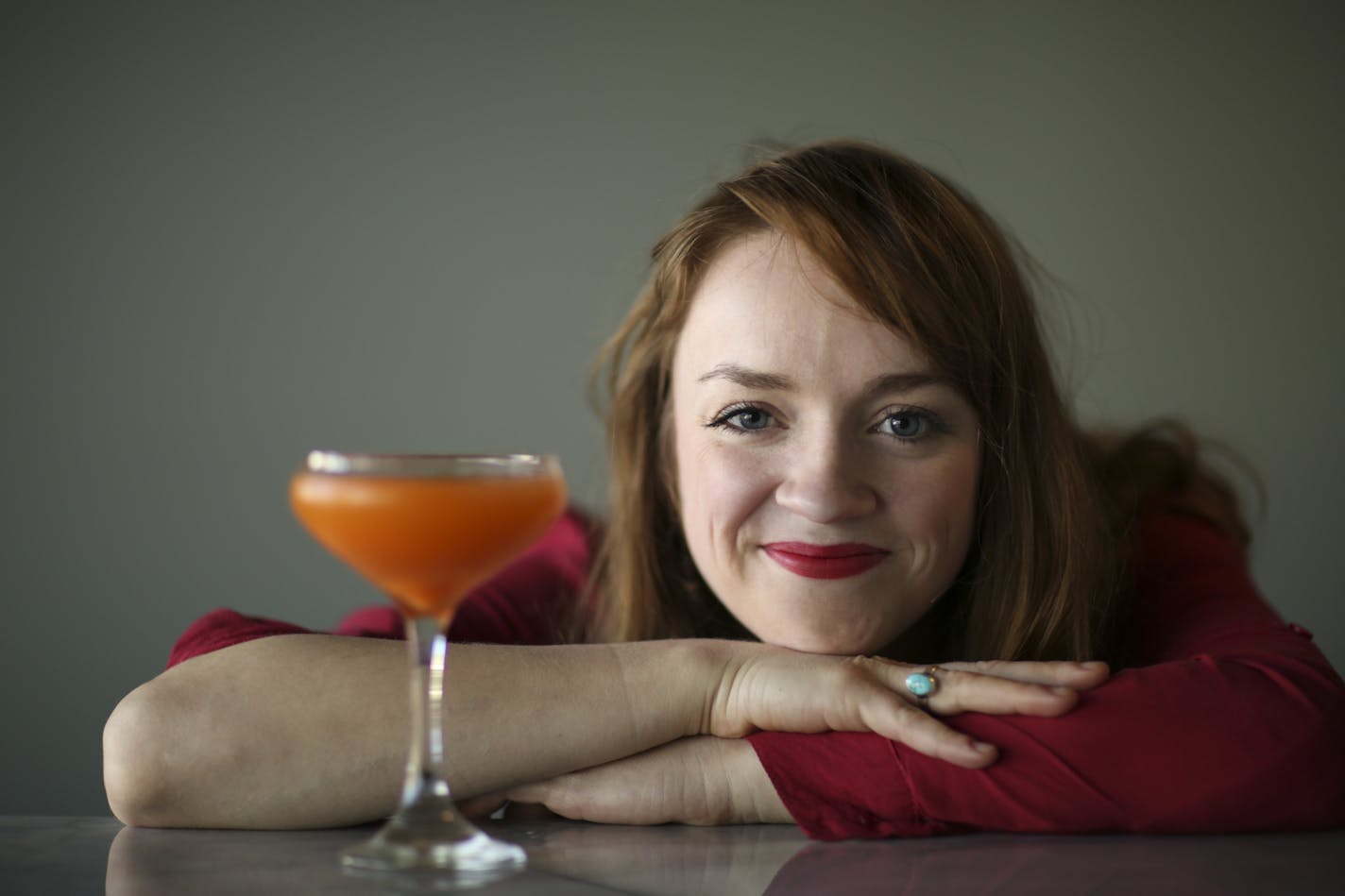 Britt Tracy, bar manager at Heyday in Minneapolis, with the Orange Mustache, a new drink she's been working on.