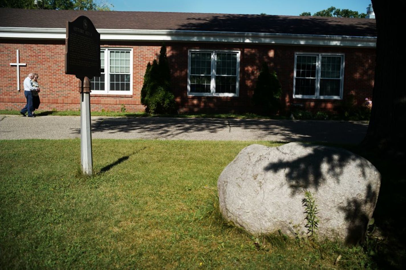 Members arrive for Sunday service. The Newport United Methodist Church plans to return the Red Rock -- which sits on church property -- back to the Dakota people, after months of discussion with church and tribal leaders about the significance of the sacred rock's history to both communities.