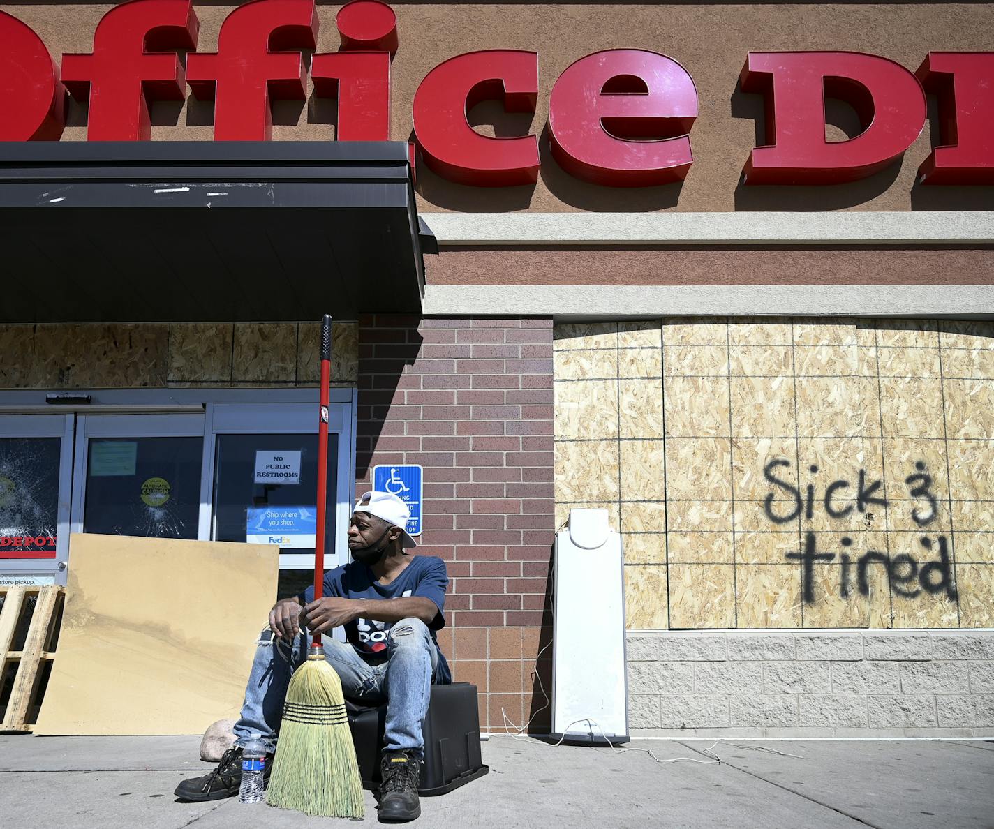 Leonard Taylor, 51, of Minneapolis, took a break from cleaning outside the looted Office Depot on Nicollet Saturday afternoon. "It's terrible, terrible," said Taylor, who lives in the neighborhood. "The grocery store is gone...What about Walgreens where I get my mom's medicine?...The people that live in this community haven't ever seen anything like this before over and over a fake $20 bill." ] aaron.lavinsky@startribune.com Protests continued in the wake of George Floyd's death in police custod