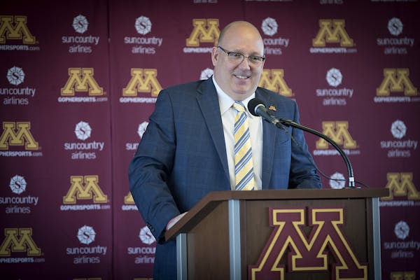 Bob Motzko, the new Gophers hockey coach hired away from St. Cloud, did not appear with other U of M coaches at a stop in the Granite City on Wednesda