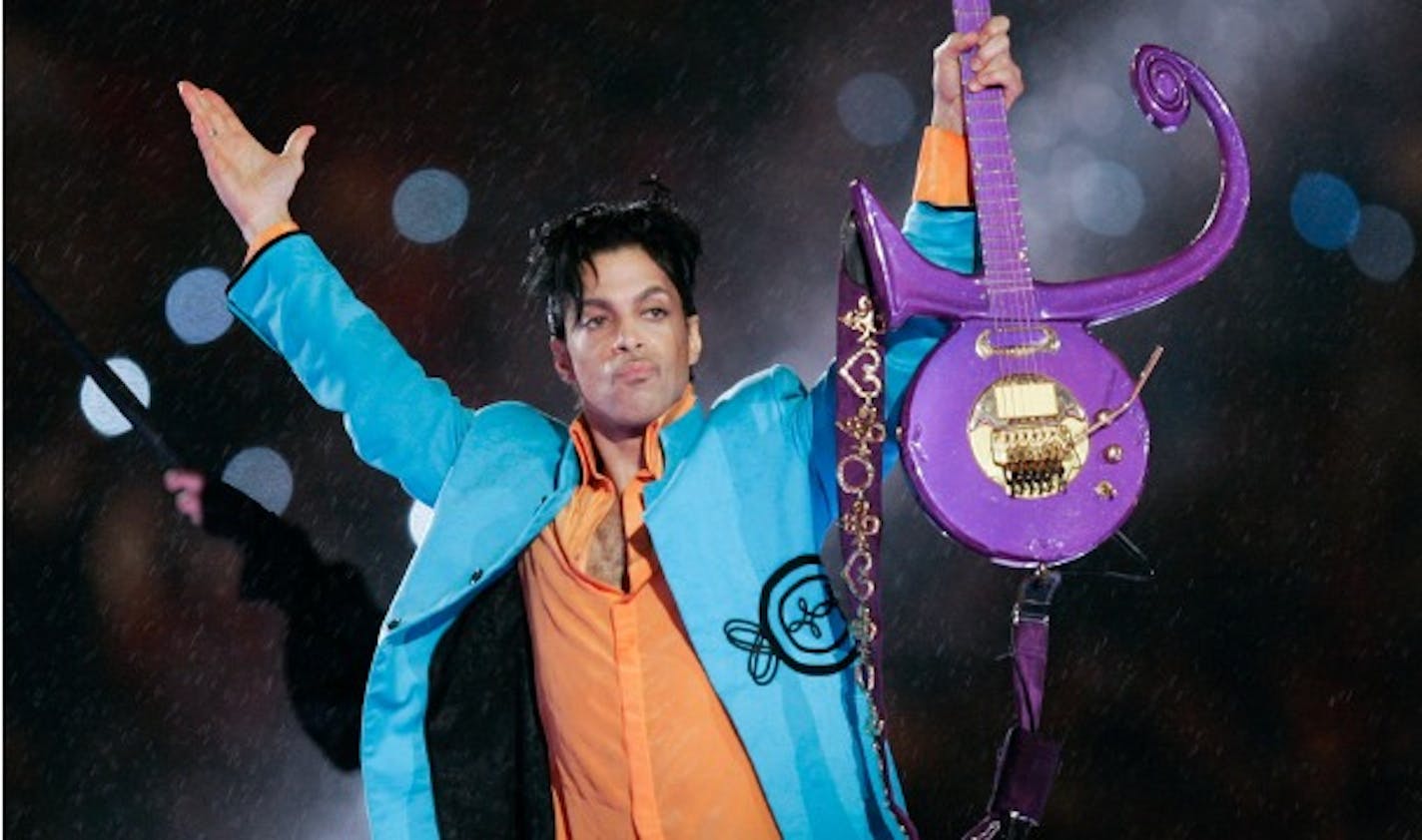 In this Feb. 4, 2007 file photo, Prince performs during halftime of the Super Bowl XLI football game in Miami.