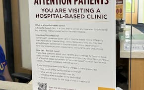 Signs such as this notice at an M Health Fairview clinic disclose to patients that they may be liable for a facility fee, which insurance may not cove