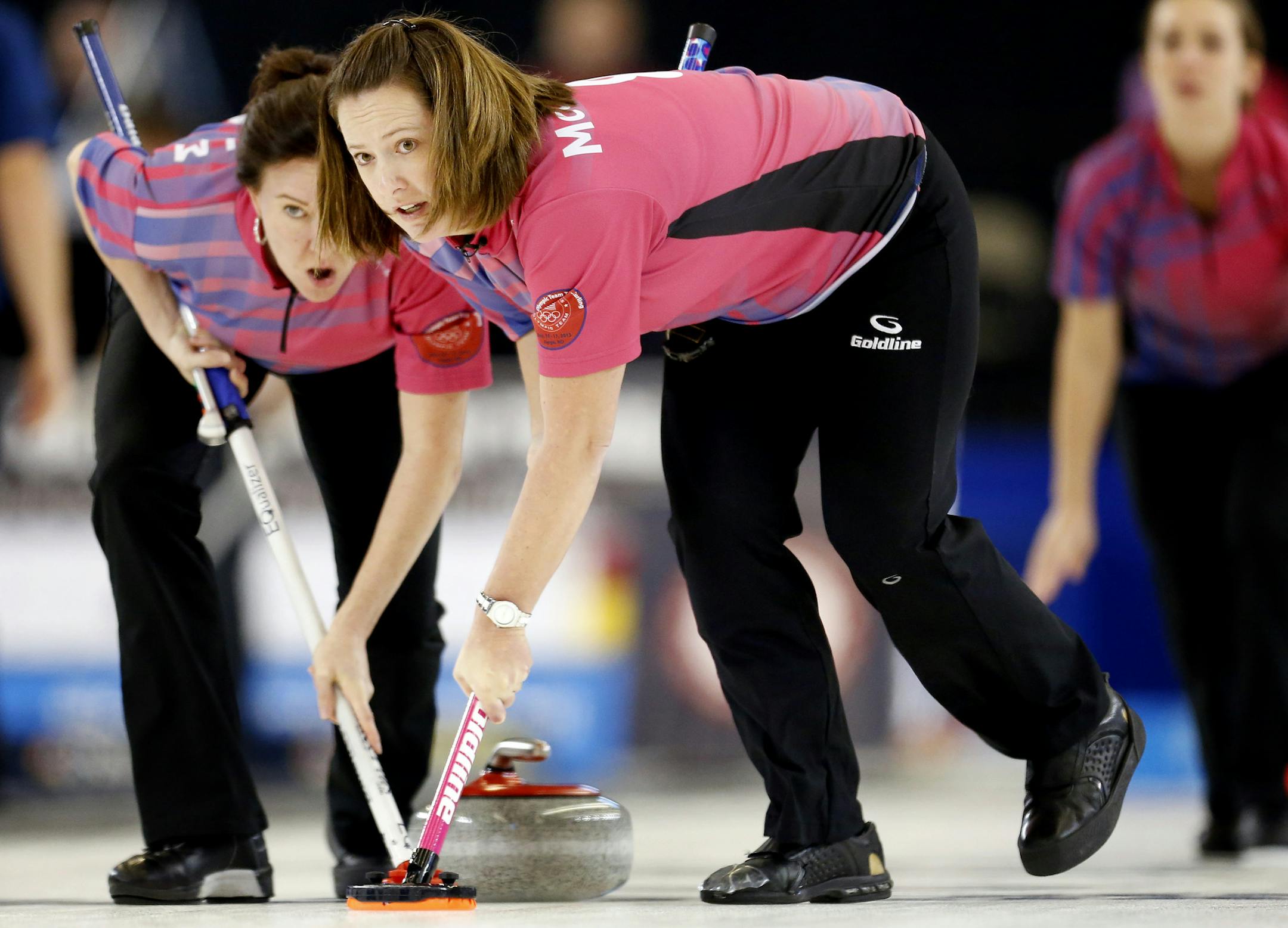 Ann Swisshelm and Debbie McCormick swept in front of the rock during the U.S. Olympic Team Trials for Curling on Friday at Scheels Arena in Fargo, ND. ] CARLOS GONZALEZ cgonzalez@startribune.com November 15, 2013, Fargo, ND, Scheels Arena, U.S. Olympic Team Trials for Curling, Road to Sochi