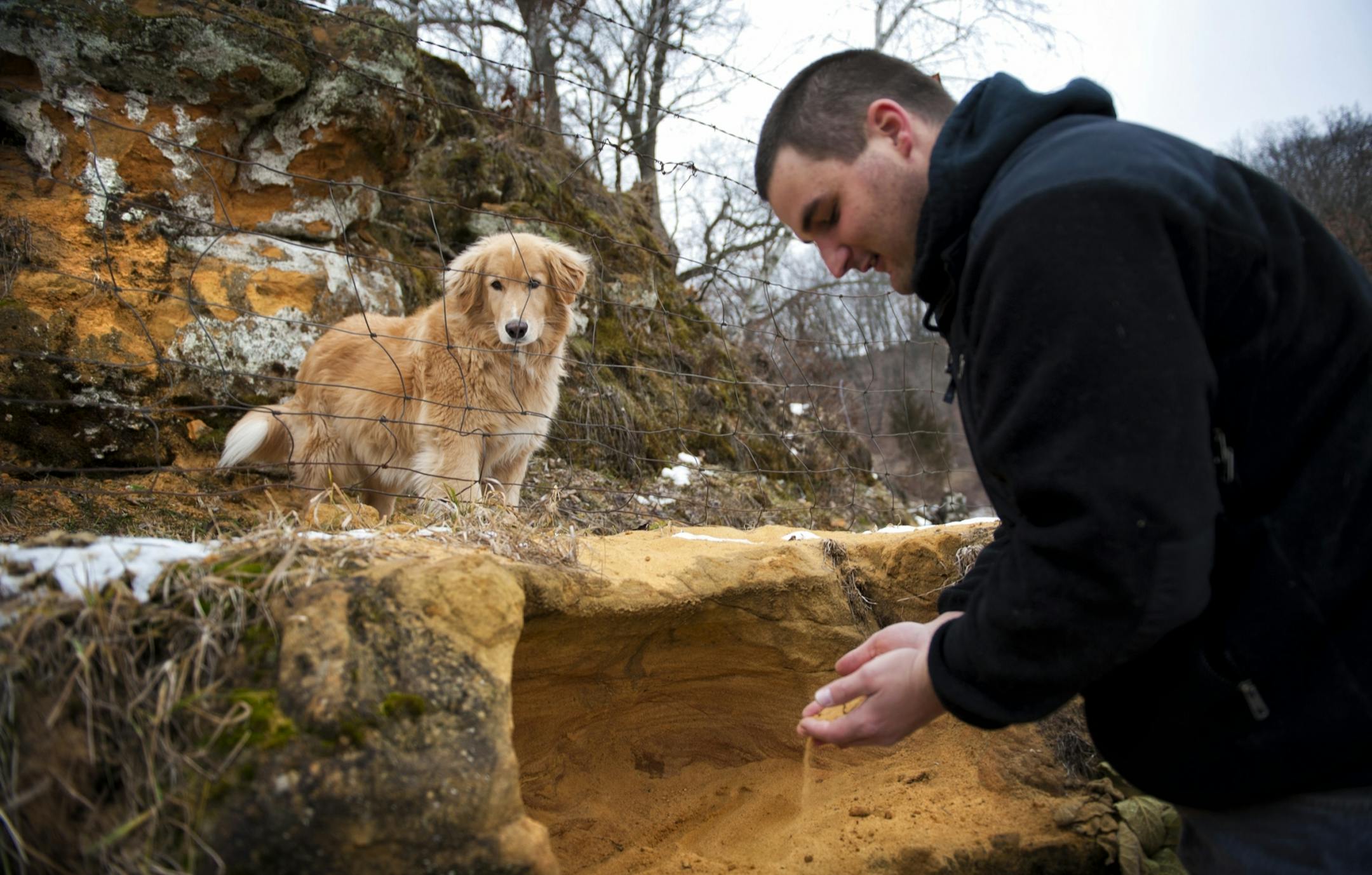 Kyle Slaby, whose mining permit is in limbo, sifted through an outcropping of sand that is valuable to the mining companies.