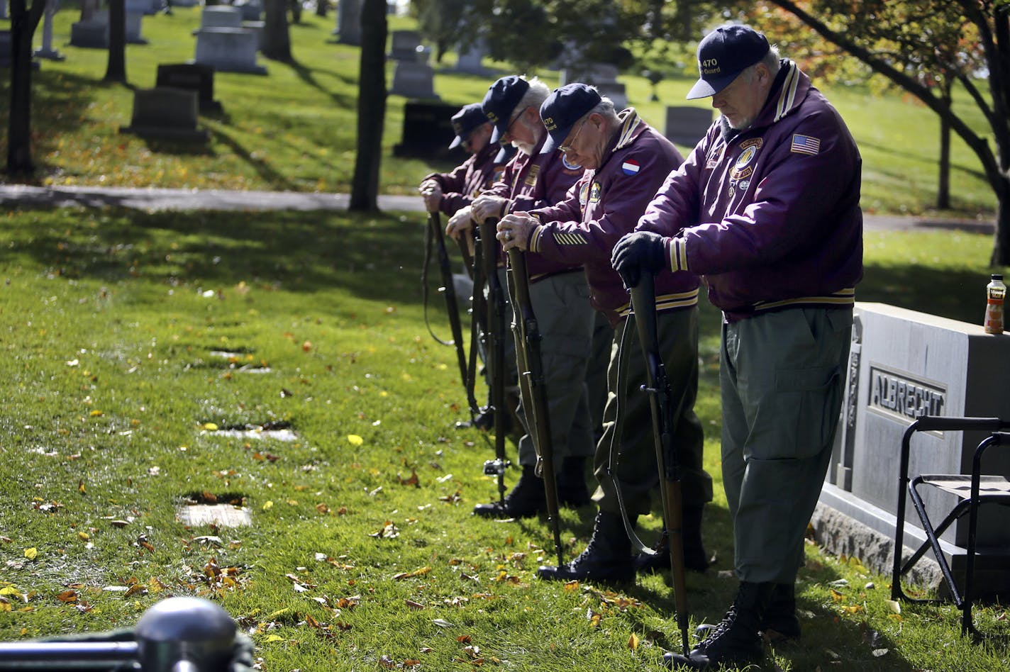 Vietnam Veterans of America Post 470 Honor Guard members Mike Clark, Army, front to back; Greg Frikken, Army; Dave Redding, Navy; Sam Hermanstorfer, Army; and Bruce Graner, Army, seen drilling prior to funeral services Saturday, Oct. 26, 2013, for Army vet James Whitmore at Lakewood Cemetery in Minneapolis, MN. Often times members of the America Post 470 Honor Guard from Anoka County arrive hours before the funeral to prepare and be in place for its start.](DAVID JOLES/STARTRIBUNE) djoles@startr