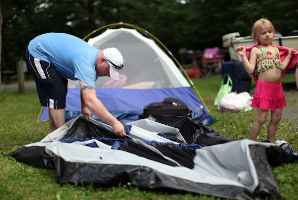Nick Wright of New Hope packed up his family's campsite at William O'Brien State Park minutes before the scheduled 4 p.m. closing of the park due to a