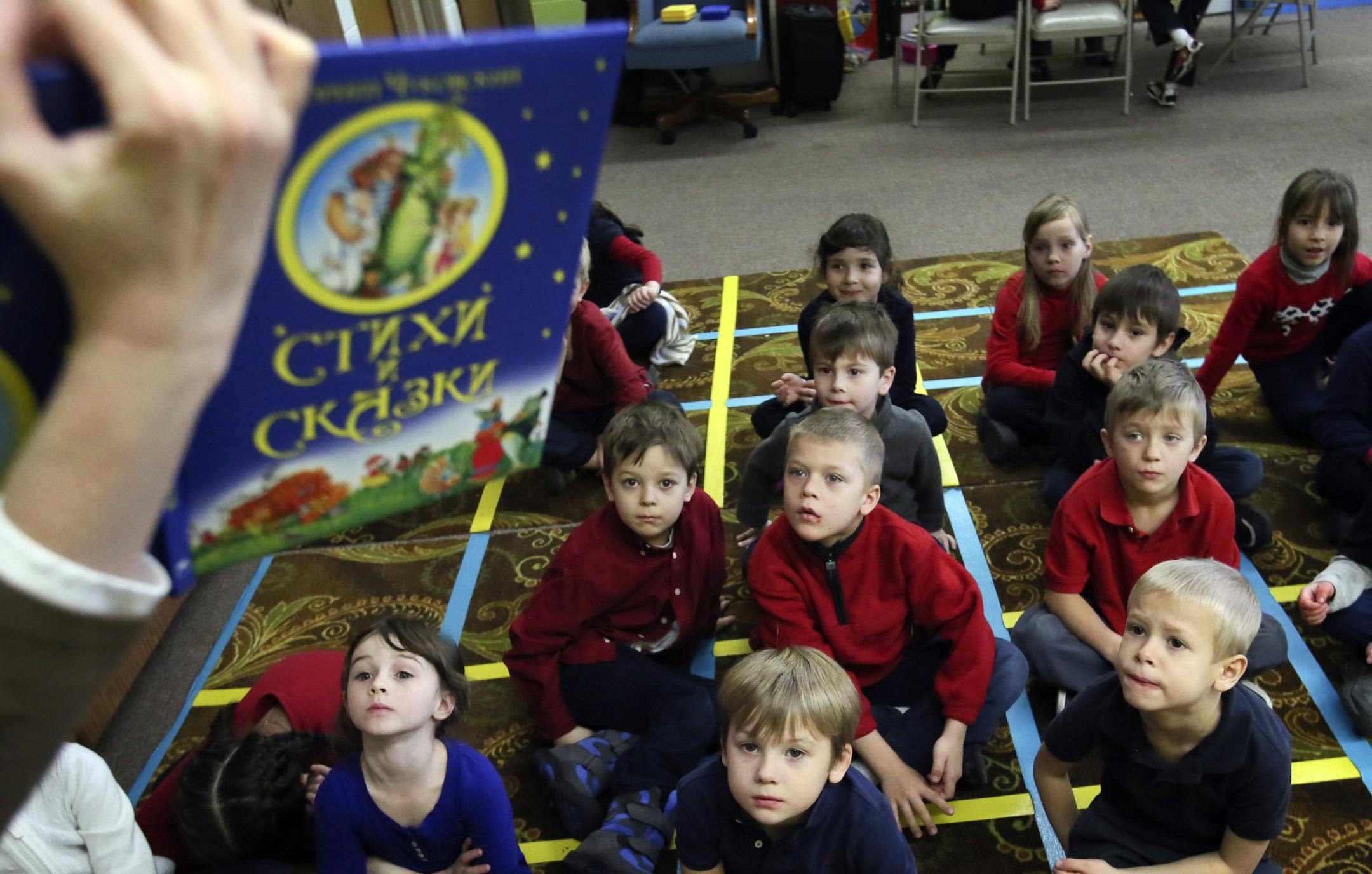 Minnetonka Charter School Nasha Shkola teacher Polina Rudenko reads from a Russian children's book to kindergarten and first grade students in Russian language class Thursday, Dec. 12, 2013, at Nasha Shkola School in Minnetonka, MN.](DAVID JOLES/STARTRIBUNE) djoles@startribune.com The west metro has seen a huge uptick in the Russian population over the last few years, leading to the opening of the Midwest's first Russian language charter school in Minnetonka and a Russian educational center in E