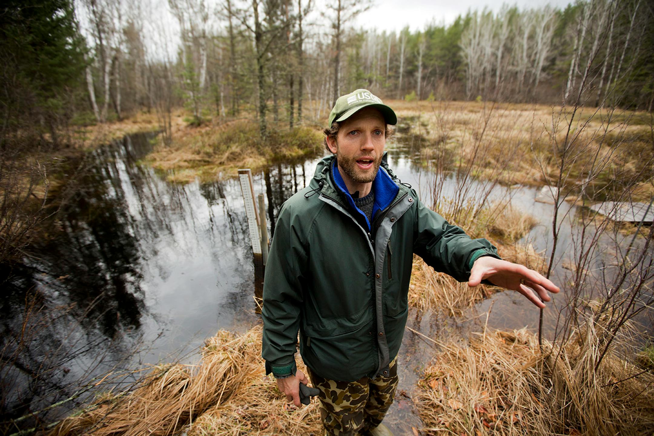 As Enbridge Energy plans another crude oil pipeline through northern Minnesota bog lands, state environmental officials are worried about the risk of another spill in sensitive natural areas. At the site of 1979 spill near Bemidji, scientists have dotted the landscape with bore holes to study of the lingering underground pollution. Here, US Geological Survey hydrologist Jared Trost stands in a pond near the "spray field" from the 1979 pipeline rupture. ] BRIAN PETERSON • brian.peterson@startribu