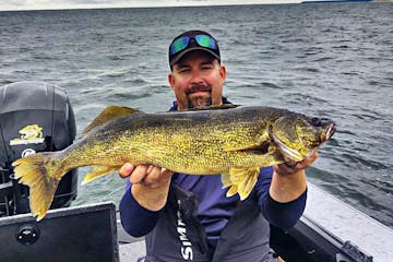 Twin Cities angler Cory Villaume bought his first forward-facing sonar unit about four years ago. Here, Villaume's friend, Justin Wathke, holds a wall