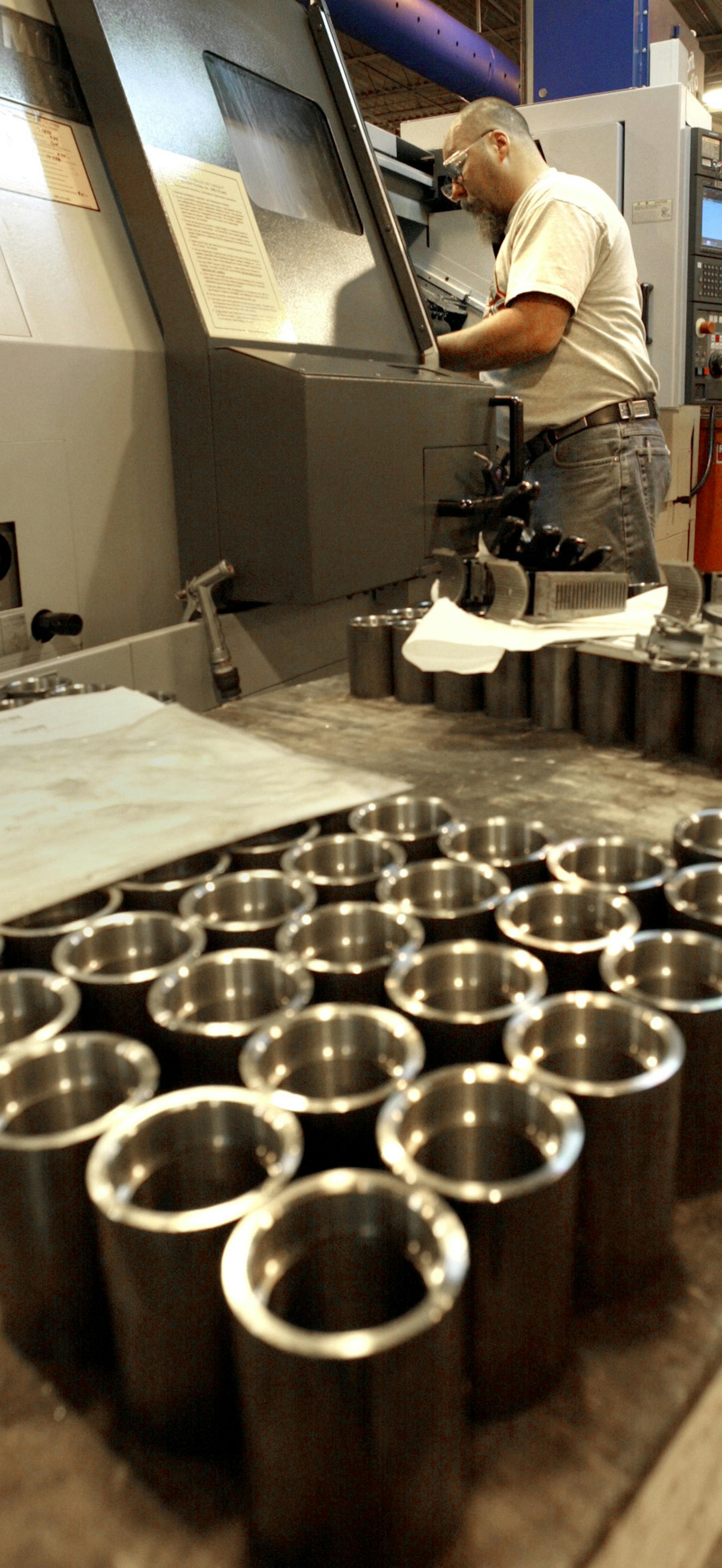 Maple Grove, MN 3/13/2003 Tennant Company, continues to invest in heavy equipment despite economic uncertainty,- Rick Van Horn assembles a lathe to manufacture bearing housings.