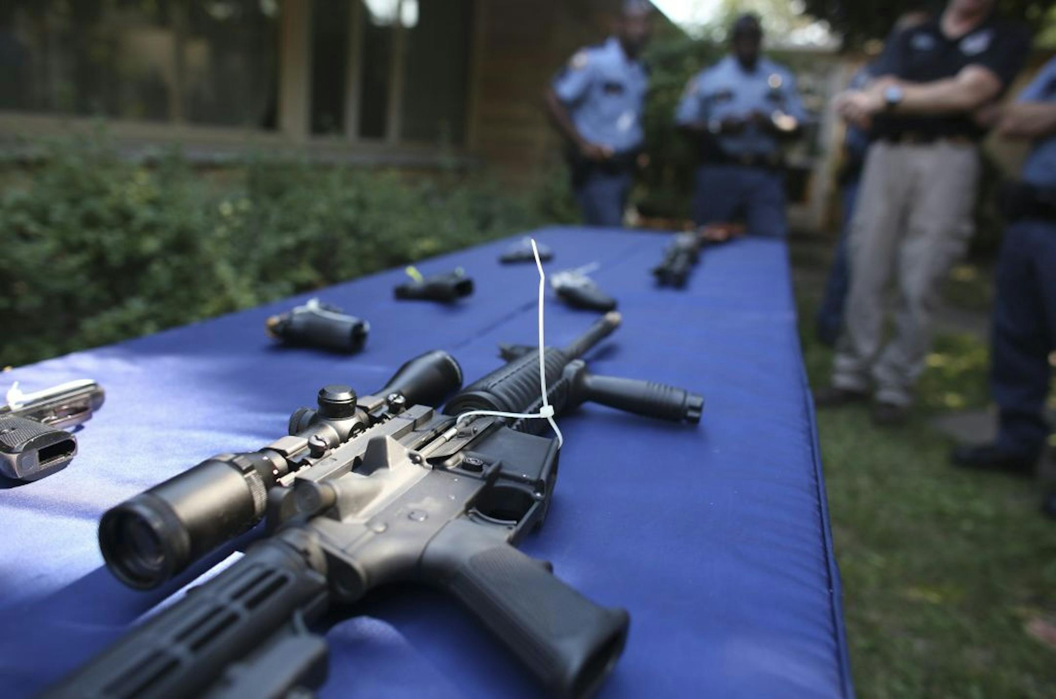 Guns were displayed during a news conference at New Hope Baptist Church in St. Paul to show the types of weapons authorities are taking off the streets.
