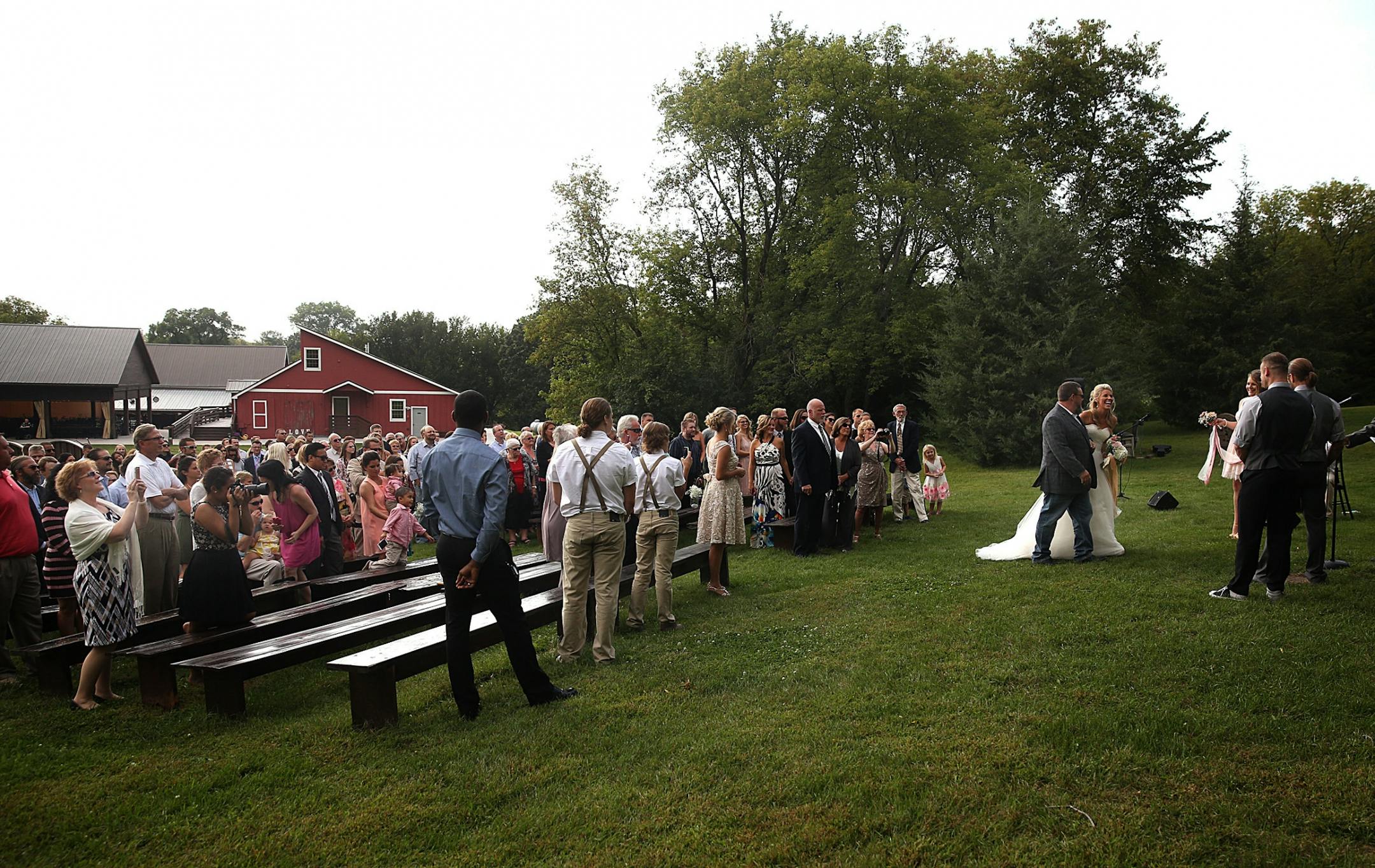 Bride Savannah Koehnen and her father, Gary Koehnen, joined the rest of the wedding party, including groom Jeremy Eckert.