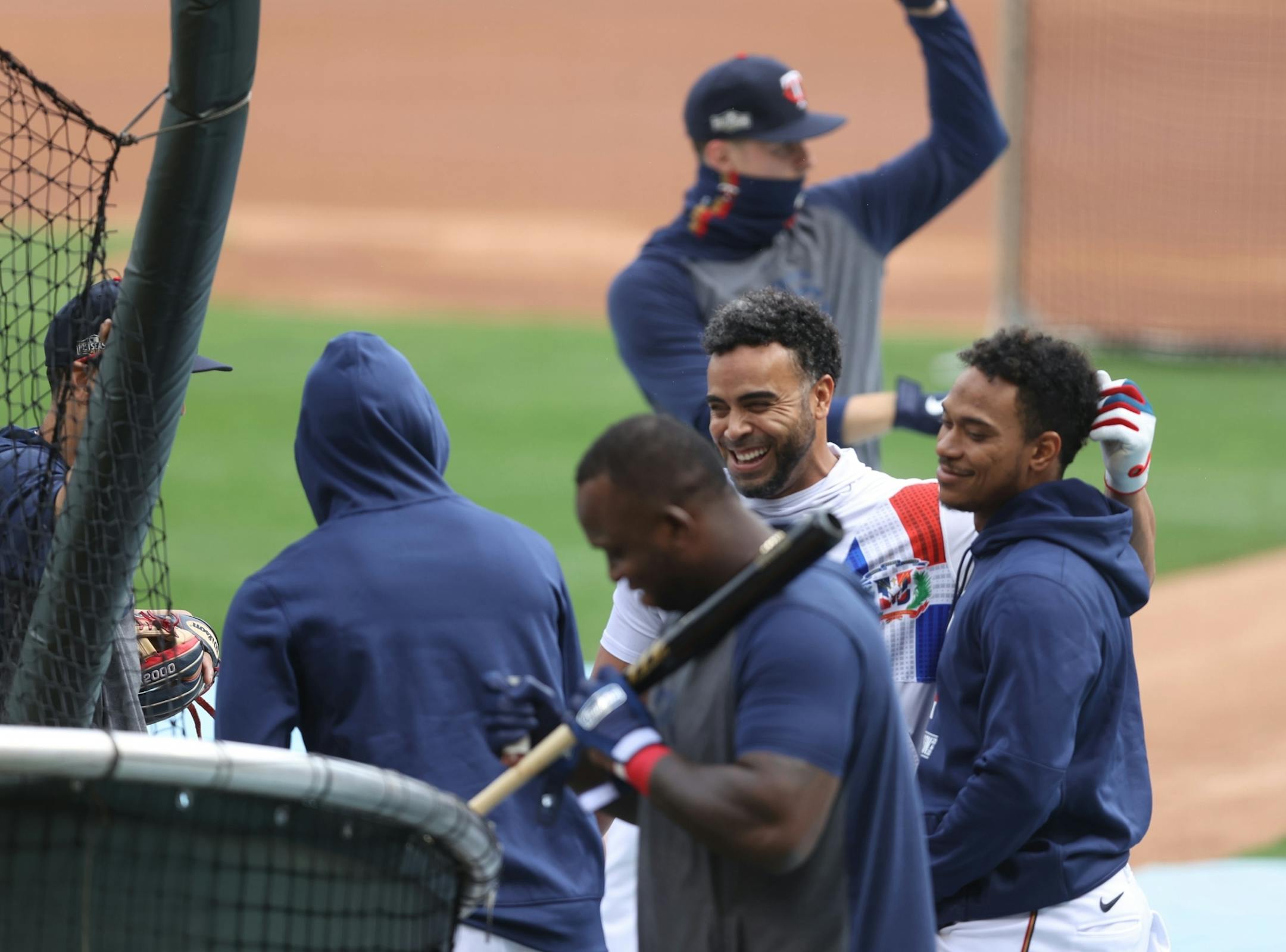 Minnesota Twins designated hitter Nelson Cruz (23) center with teammates during batting practice.