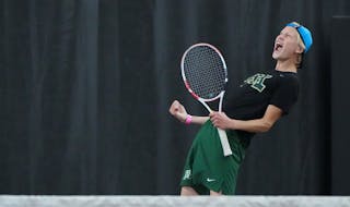 Rochester Mayo's Ben Erickson celebrates a winning point against Wayzata in the state Class 2A team tournament at the Baseline Tennis Center on the ca
