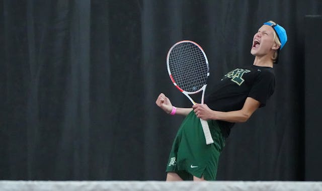 Rochester Mayo's Ben Erickson celebrates a winning point against Wayzata in the state Class 2A team tournament at the Baseline Tennis Center on the ca