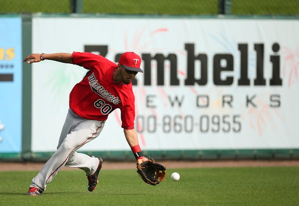 Twins outfielder Eddie Rosario fielded a grounder in the outfield during practice at Hammond Stadium.
