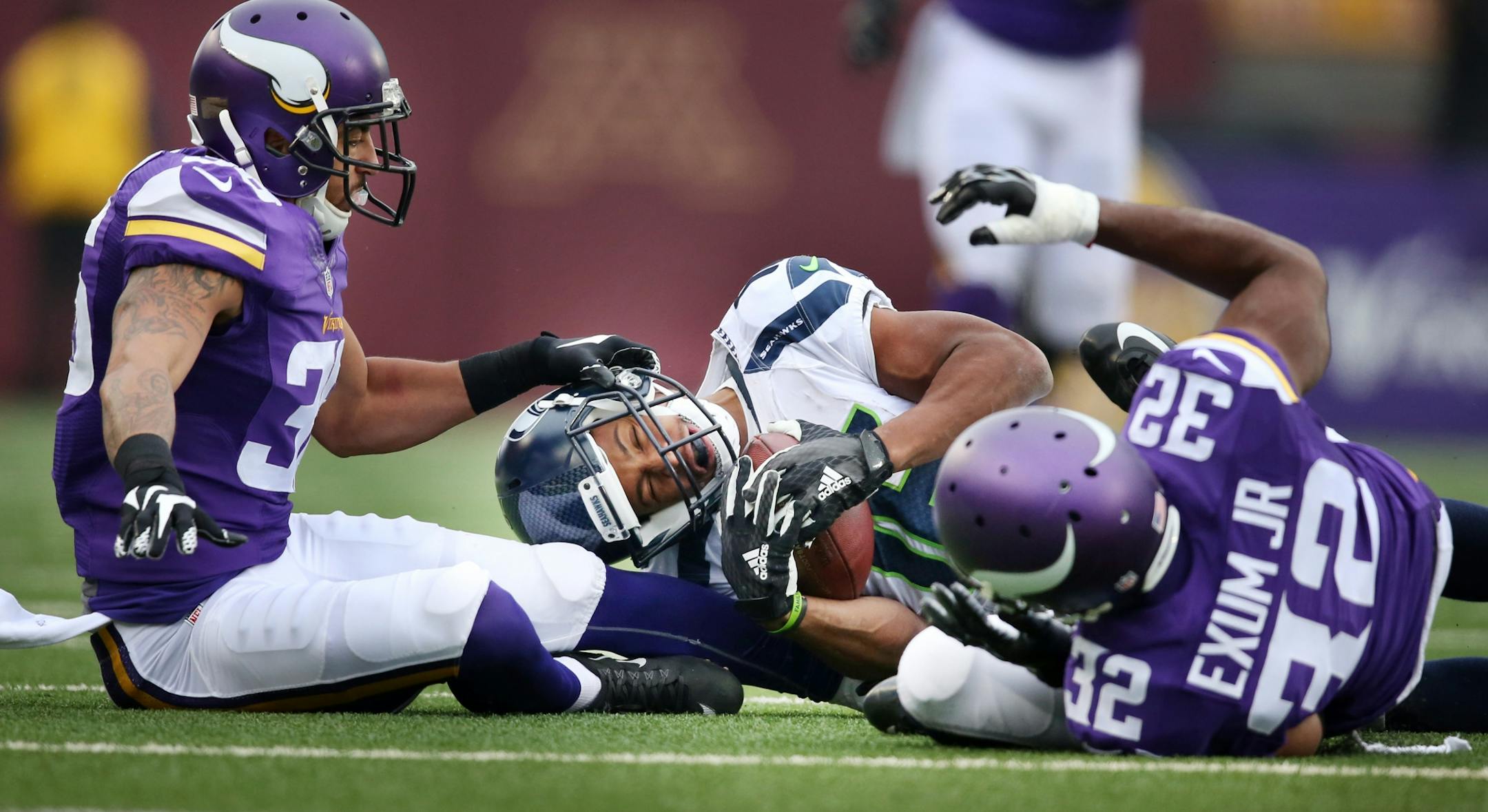 Seattle Seahawks wide receiver Tyler Lockett (16) picked up a first down as Minnesota Vikings strong safety Robert Blanton (36) reached for him, cornerback Antone Exum (32) was called for unnecessary roughness on the play Sunday December 6, 2015 in Minneapolis, MN.