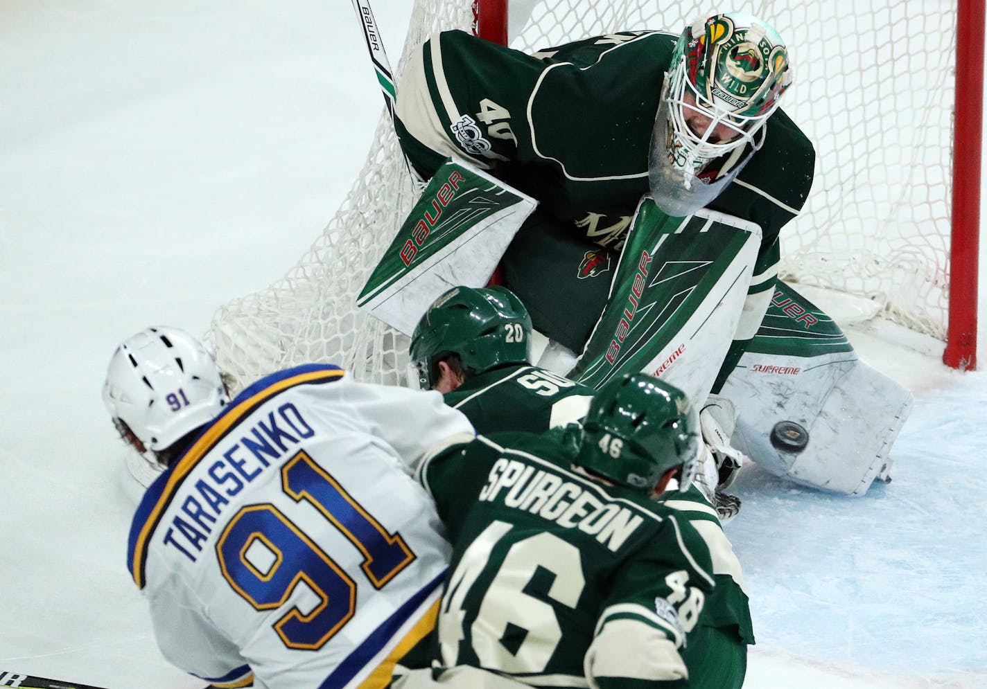 Minnesota Wild goaltender Devan Dubnyk (40) went down to stop a shot from St. Louis Blues right wing Vladimir Tarasenko (91) as Minnesota Wild defenseman Ryan Suter (20) and defenseman Jared Spurgeon (46) defended in the third period. ] ANTHONY SOUFFLE &#xef; anthony.souffle@startribune.com Game action from an NHL playoff game 2 between the Minnesota Wild and the St. Louis Blues Friday, April 14, 2017 at the Xcel Energy Center in St. Paul, Minn.