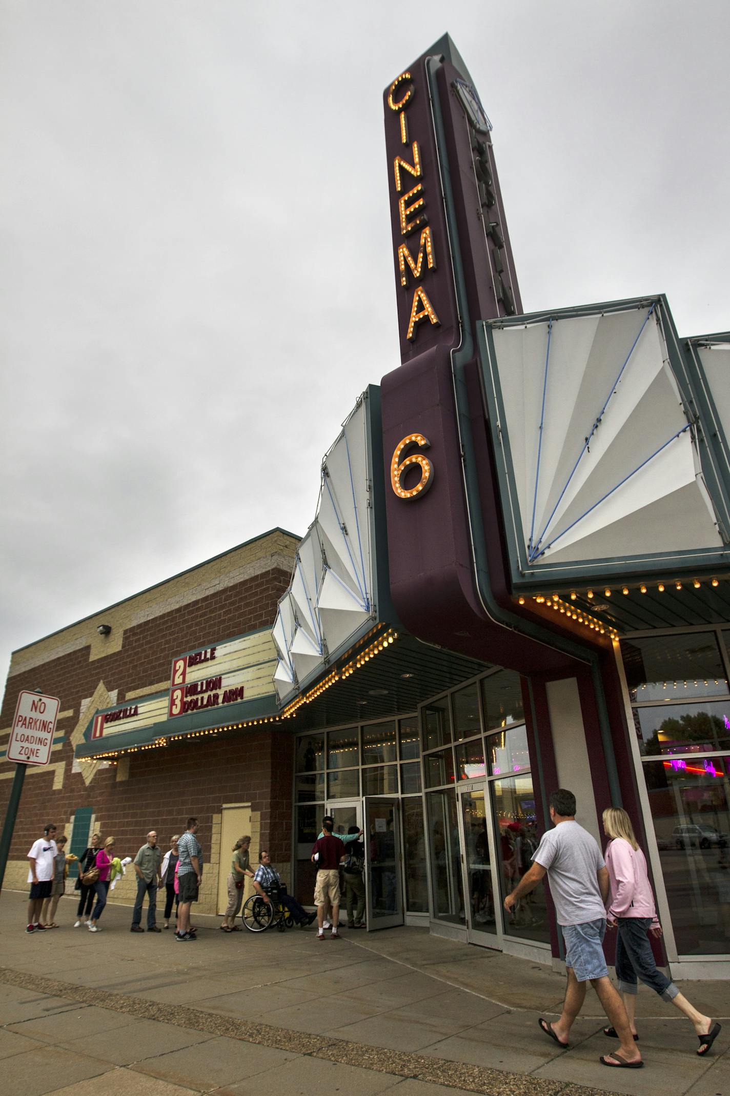 A line stretches out the door at Mann Hopkins Cinema 6, a discount movie theater, in Hopkins July 25, 2014. (Courtney Perry/Special to the Star Tribune)