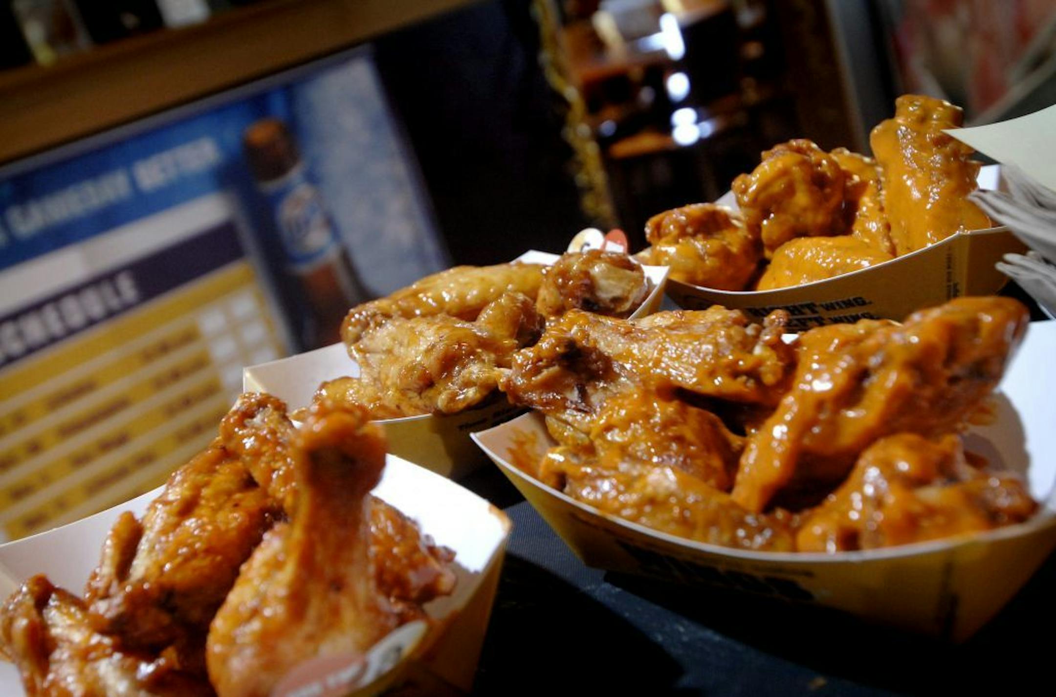 GLEN STUBBE * gstubbe@startribune.com Wednesday, October 3, 2007 -- Oakdale, Minn. -- A platter of Buffalo Wild Wings is served to lunch-hour customers at the Buffalo Wild Wings restaurant in Oakdale, Minn.