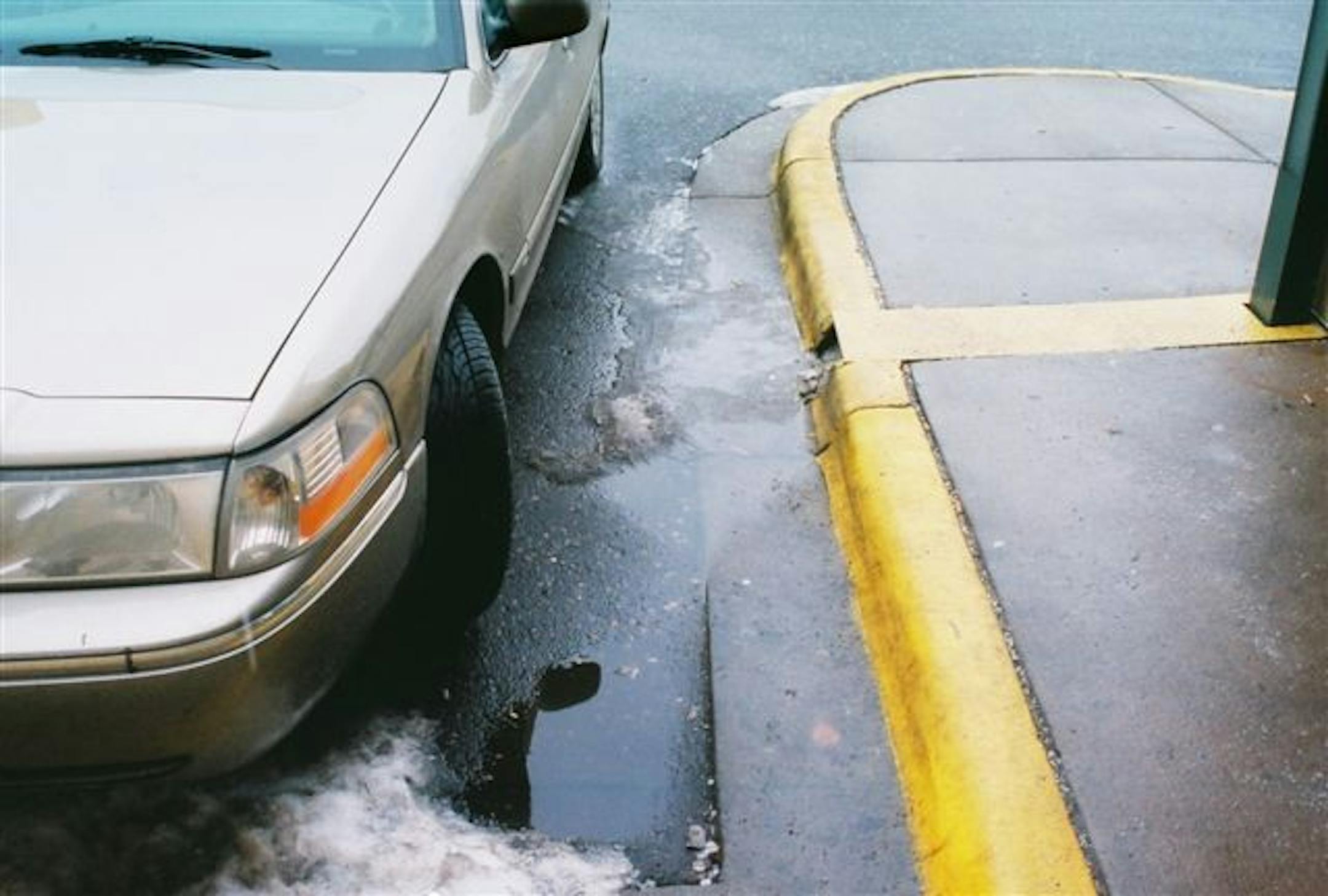 Downspout emptying into Denny's parking lot on Northdale Blvd. in Coon Rapids.