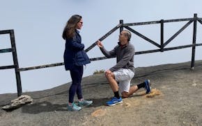 Doug Cotty's proposal to Michele Arias at the top of the volcano, captured by their tour guide.