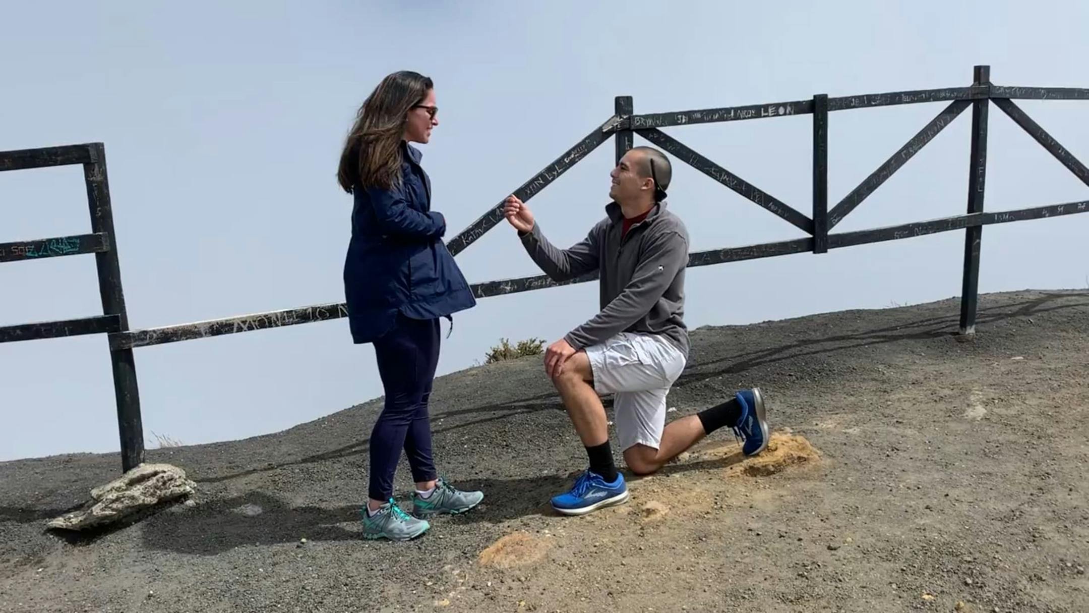 Doug Cotty's proposal to Michele Arias at the top of the volcano, captured by their tour guide.