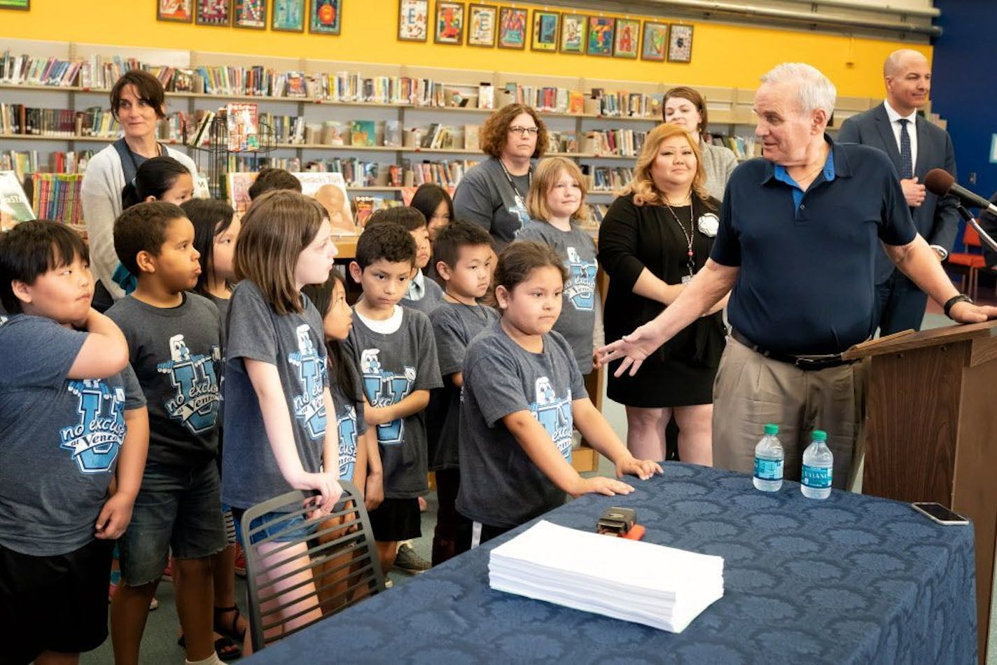 Gov. Mark Dayton vetoed the Republican tax bill at Bruce Vento Elementary in St. Paul and called attention to his own bid to pressure Republicans to approving emergency state aid for schools.