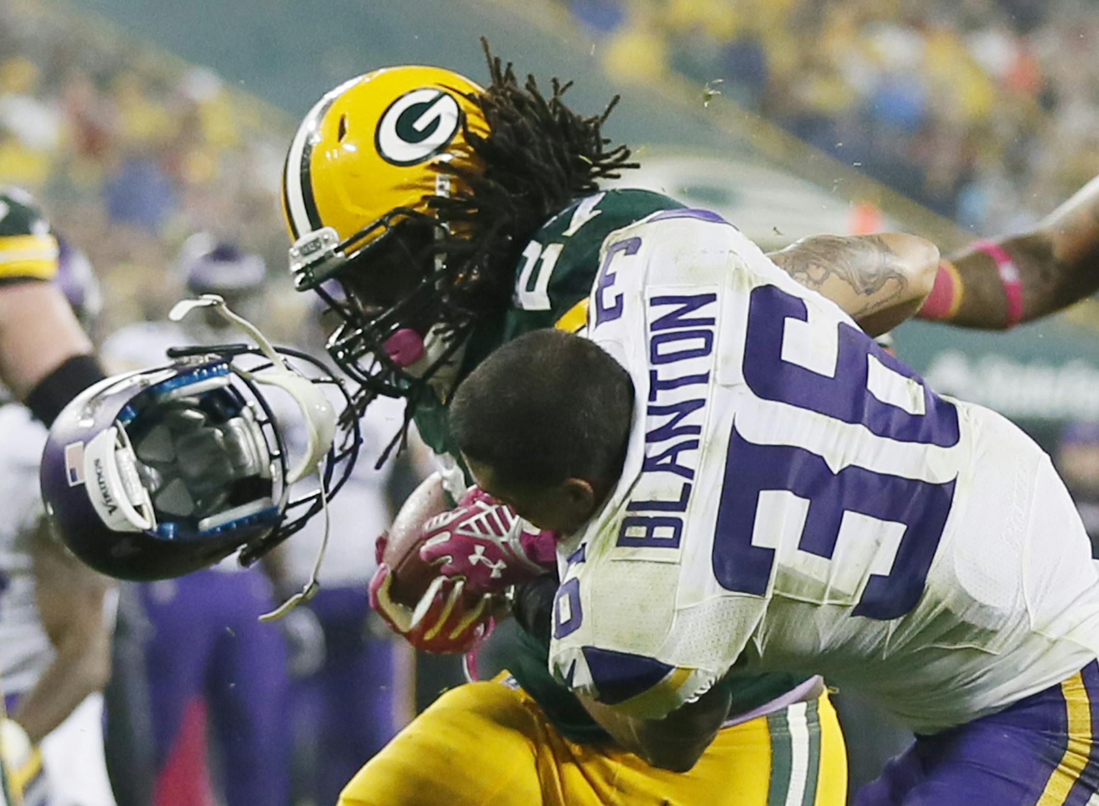 Green Bay Packers running back Eddie Lacy (27) scored his second touchdown in the third quarter, as Minnesota Vikings strong safety Robert Blanton (36) lost his helmet .The Minnesota Vikings played the Green Bay Packers Thursday October 2 , 2014 at Lambeau Field in Green Bay ,WI. ] Jerry Holt Jerry.holt@startribune.com