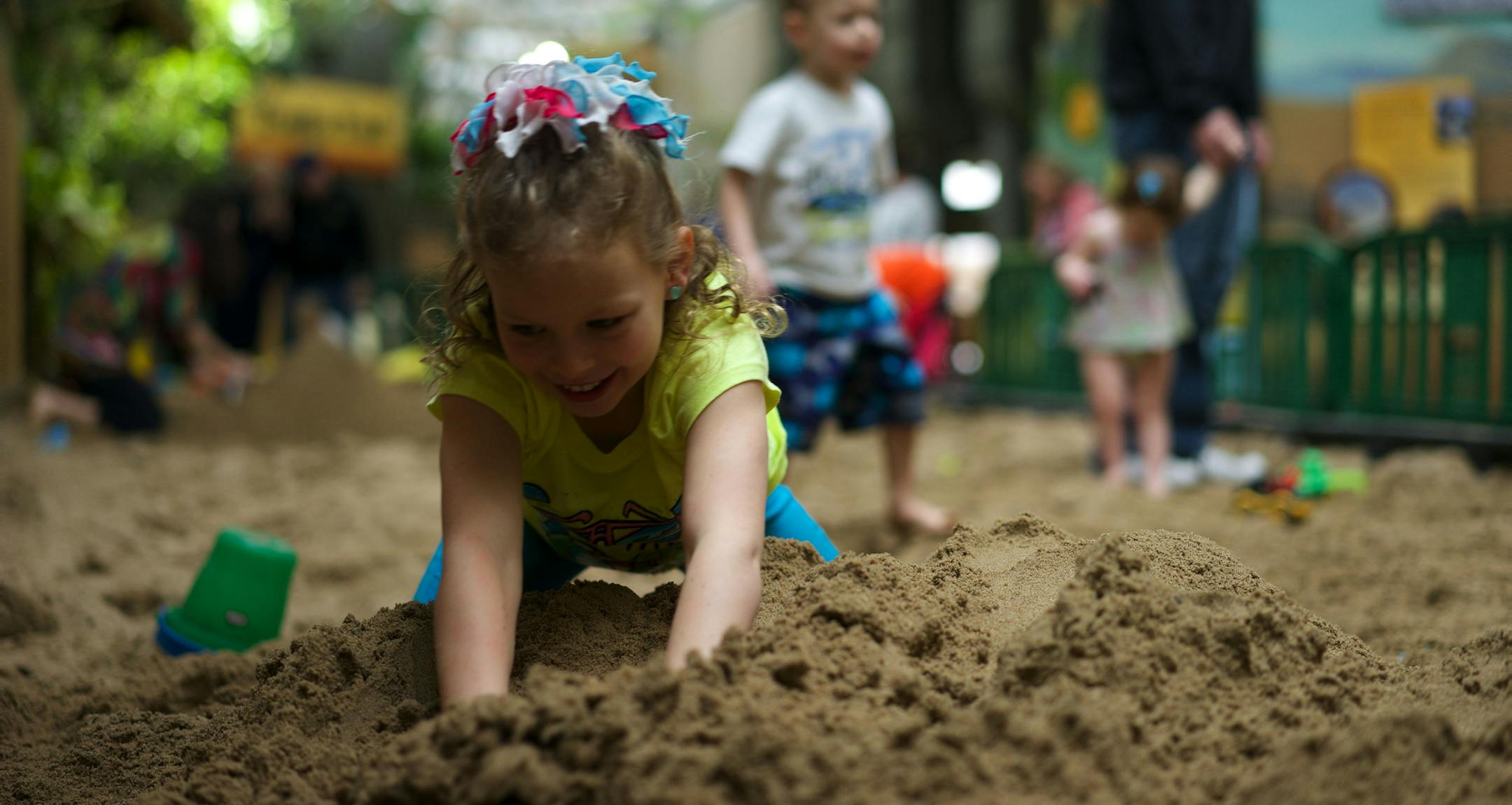Child playing at Minnesota Zoo's Beach Party.