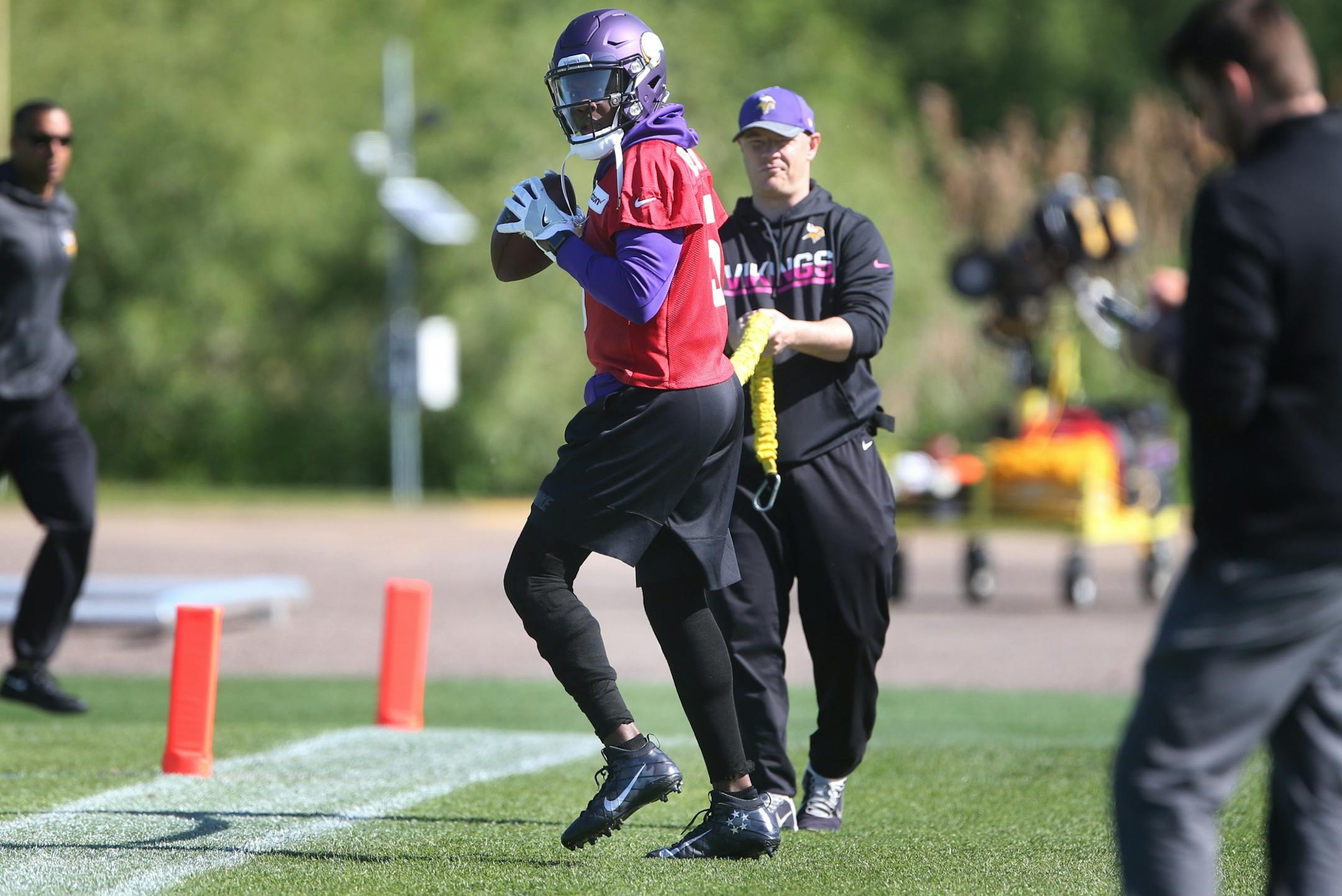 Minnesota Vikings quarterback Teddy Bridgewater worked on drills with trainer Tom Hunkele Wednesday May 31,2017 in Eden Prairie, MN.