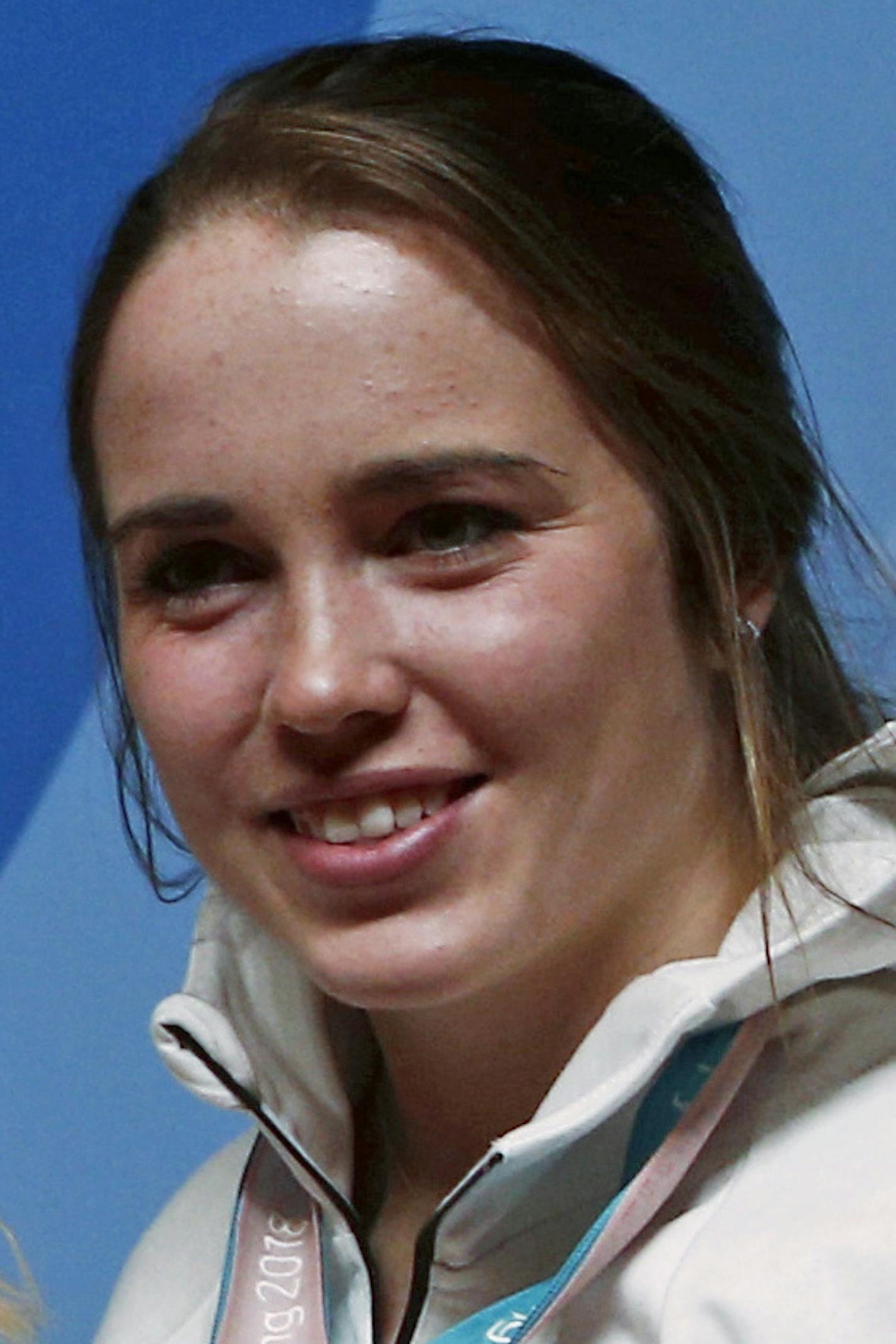 United States' Meghan Duggan, from left, Hilary Knight, Monique Lamoureux-Morando, Jocelyne Lamoureux-Davidson and Maddie Rooney pose for photos with their gold medal in women's hockey at a news conference at the 2018 Winter Olympics in Pyeongchang, South Korea, Friday, Feb. 23, 2018. Twenty years after taking gold when the sport was added to the Olympics, the United States snapped Canada's streak of four straight golds on Thursday. (AP Photo/Peter Morgan)