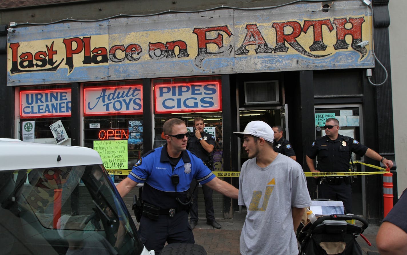 Customers of the Last Place on Earth were processed by the Duluth police and either placed in squads or released. Earlier, U.S. Marshalls, DEA and Duluth Police burst out a transit bus and stormed the Last Place on Earth head shop on Superior Street in downtown Duluth on a drug raid on 7/25/12.