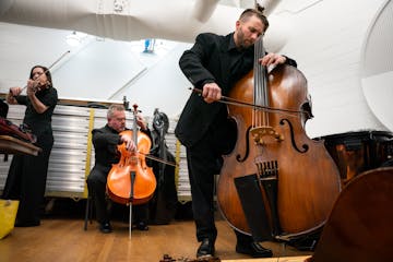 Nicholas Gaudette from Edina High School warms up backstage with other music educators before Saturday's concert.